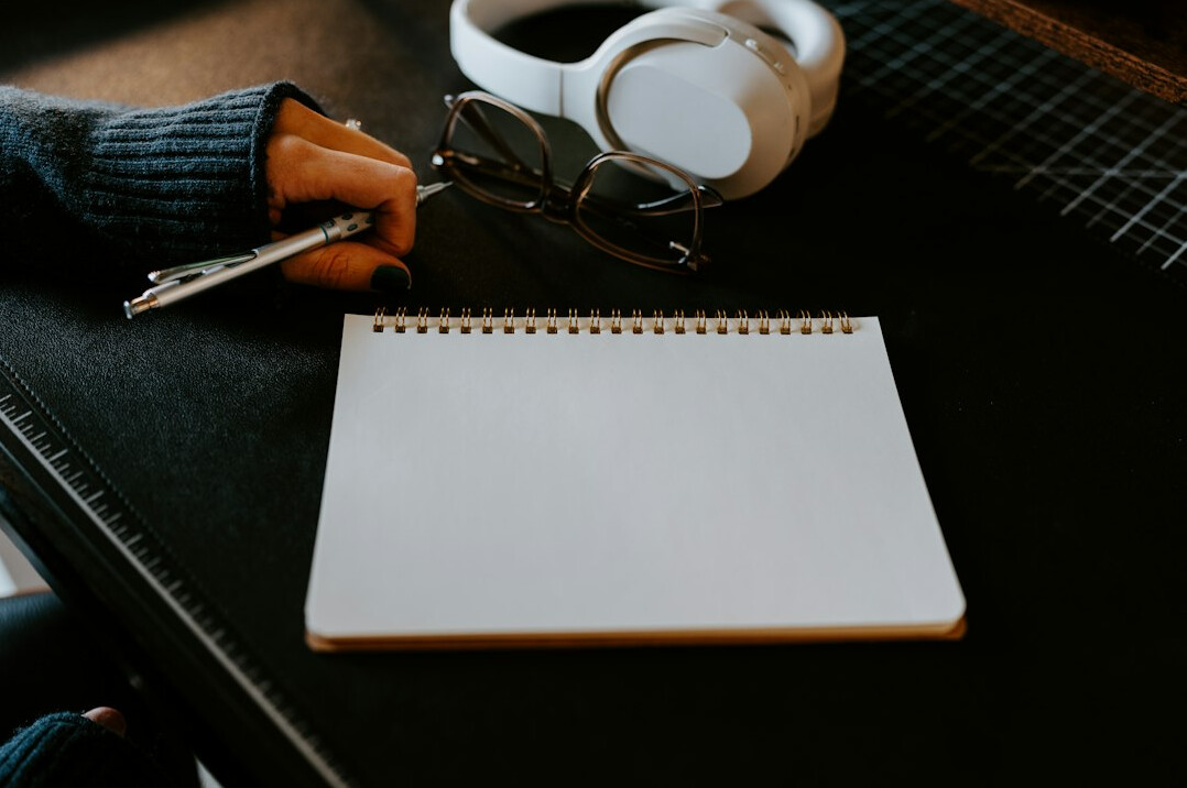 writer at desk with notebook