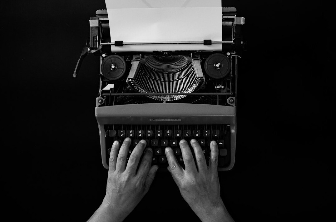 mystery writer at typewriter